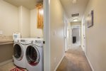 Large laundry room with folding counter, upper level